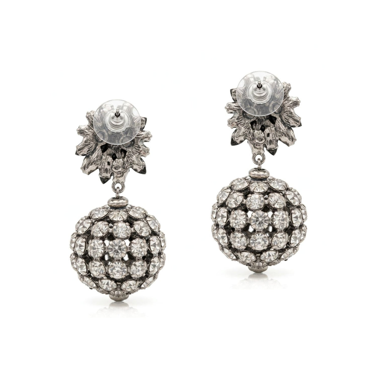 Studio product shot showing the reverse side of the Sparkling Bloom Earrings on a white background, focusing on the gunmetal-tone finish, standard post hardware, and clear comfort-disc backings.