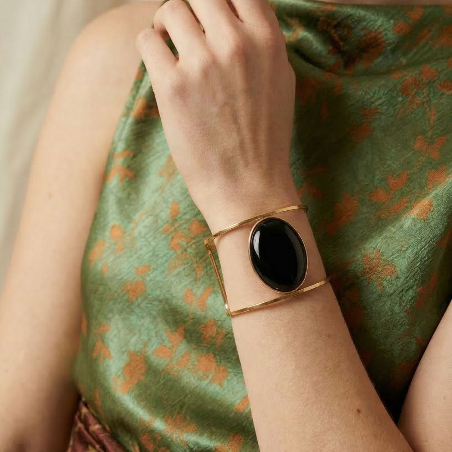 The Jared Jamin Stella Cuff in Black Onyx, showcasing the slim 18K gold-plated hammered band and the deep black gemstone accent.