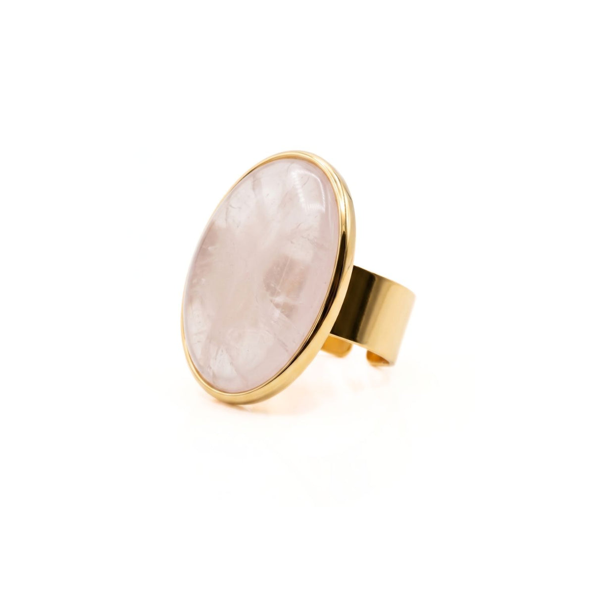 The Stella Statement Ring in Rose Quartz spotlights a hand-set, oval-cut blush stone carved in our West Hollywood studio—its smooth bezel on an adjustable gold band. Crafted in eco-conscious, small batches. Style Note: punctuates denim or evening silk.