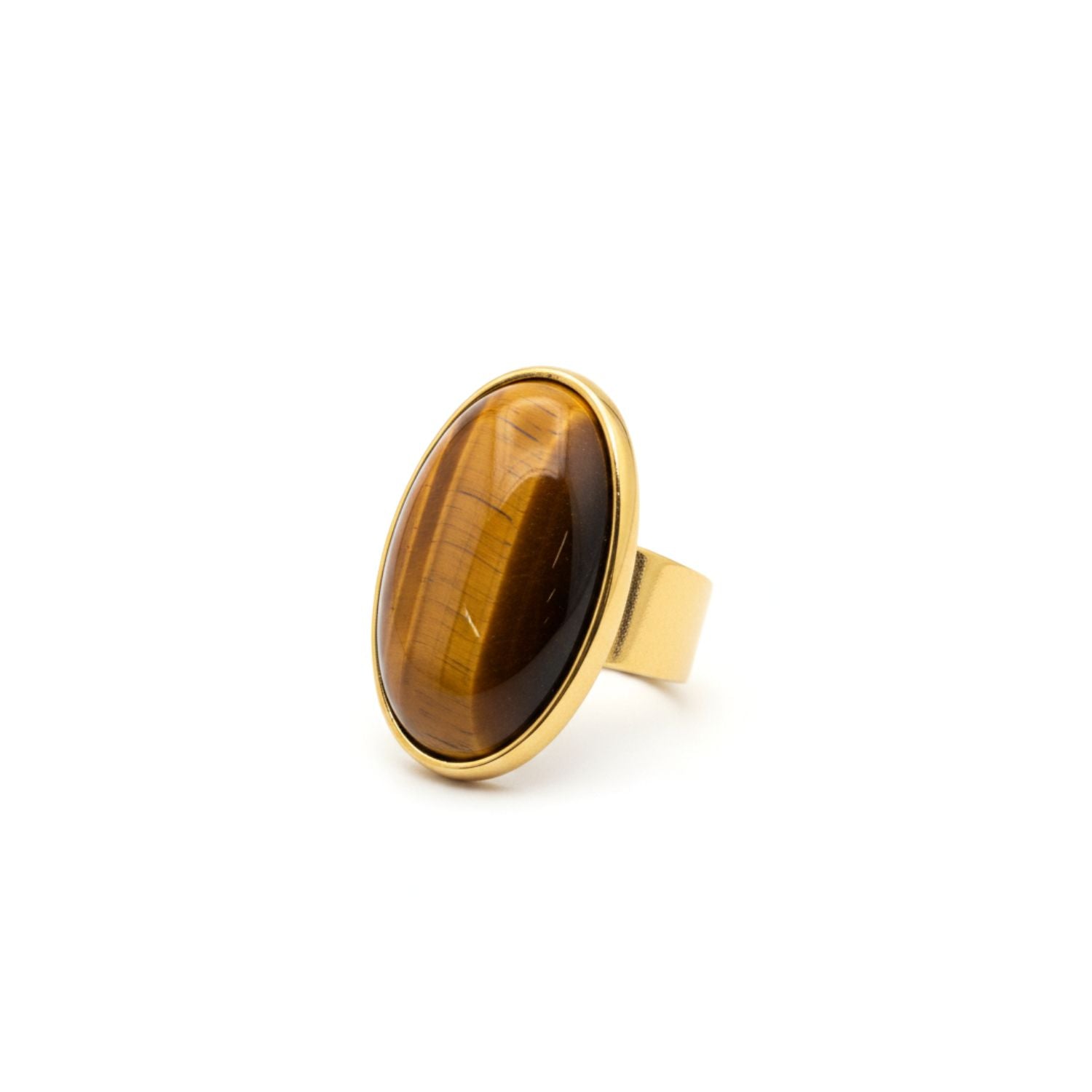 The Stella Statement Ring in Tiger's Eye by JAREDJAMIN Jewelry Online is an adjustable 18K gold-plated ring featuring a large oval Tiger’s Eye gemstone with striking brown and golden bands in a simple bezel setting.