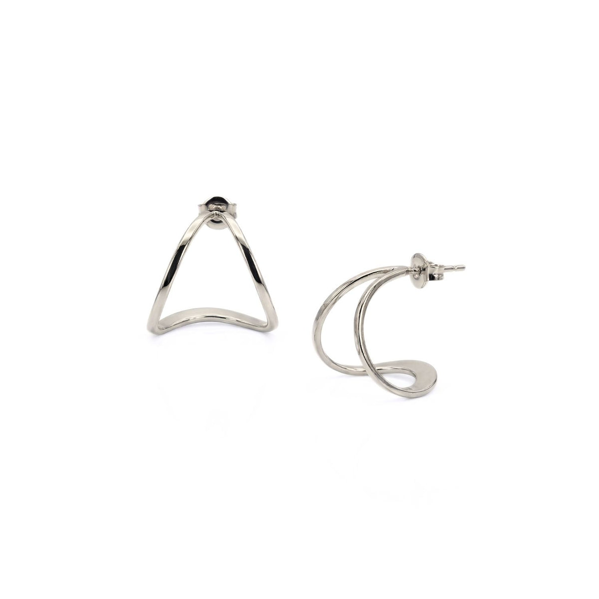 Silver Tabby Earrings, hand-assembled in our West Hollywood studio, punctuate minimalism with geometric open triangles—one poised upright, one revealing its post. Crafted in small batches using eco-conscious methods. Style Note: shifts from tailoring to silk slip dresses.