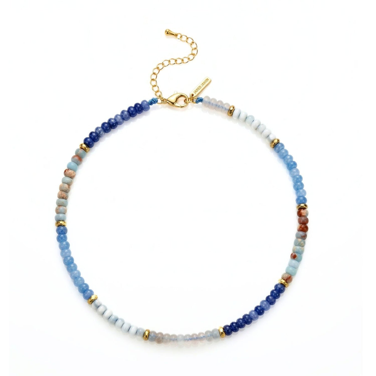 Hand-assembled in our West Hollywood studio, the Taylor Beaded Necklace Blue layers nuanced blue, light brown, white, and gold beads—punctuated by gold spacers—on an adjustable eco-conscious chain. Style Note: Bridges sharp tailoring and after-dark ease.