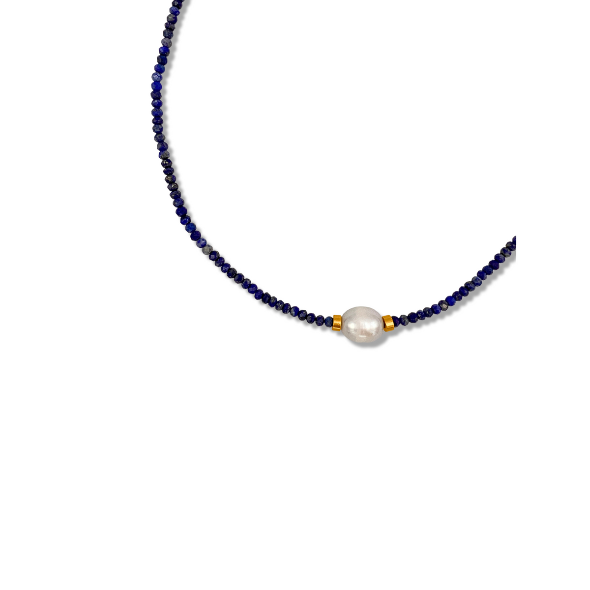 The Rowan Necklace Lapis Lazuli by JAREDJAMIN Jewelry Online features delicate dark blue lapis beads, a central freshwater pearl, and two gold spacer beads, shown on a plain white background.