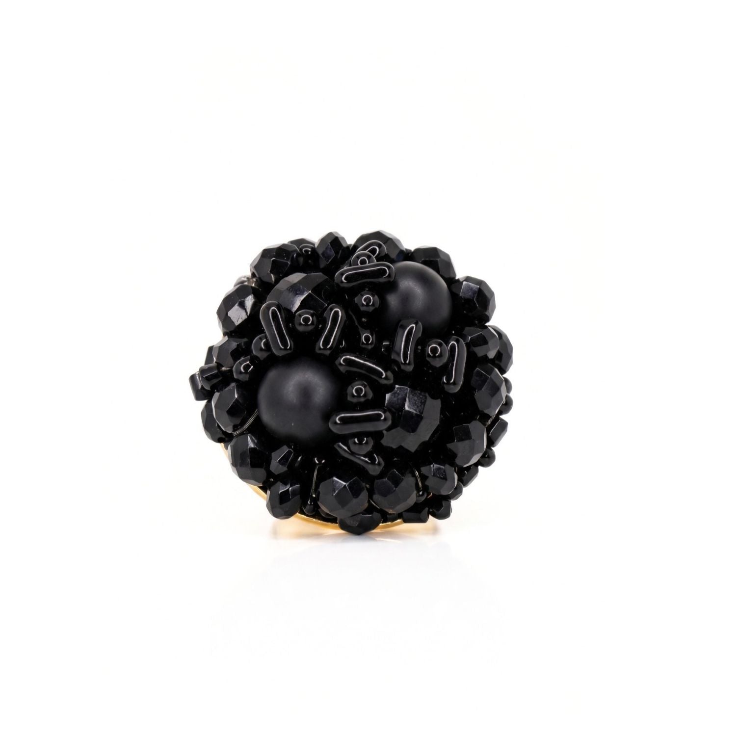 Front view of the black glass bead cocktail ring on white — a dense cluster of faceted, smooth, matte and glossy black beads across a wide round top.
