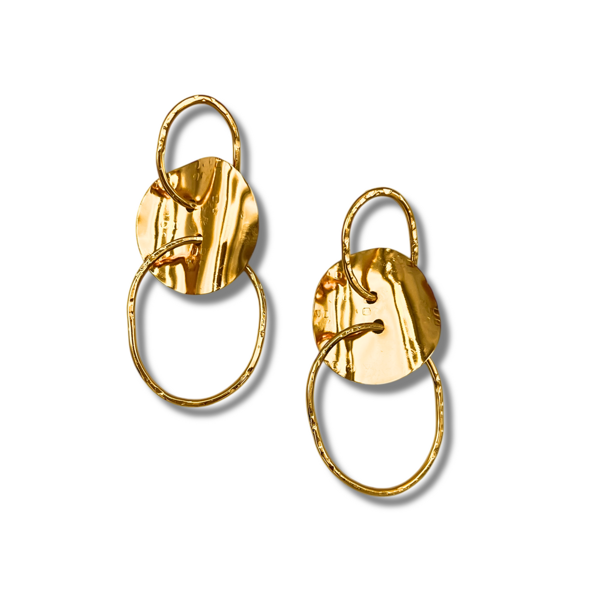 From JAREDJAMIN Jewelry Online, the Gold Viviane Post Drop Earrings feature a hammered metal disc linked to two irregular gold ovals, creating a modern, artistic look that stands out against a plain white background.