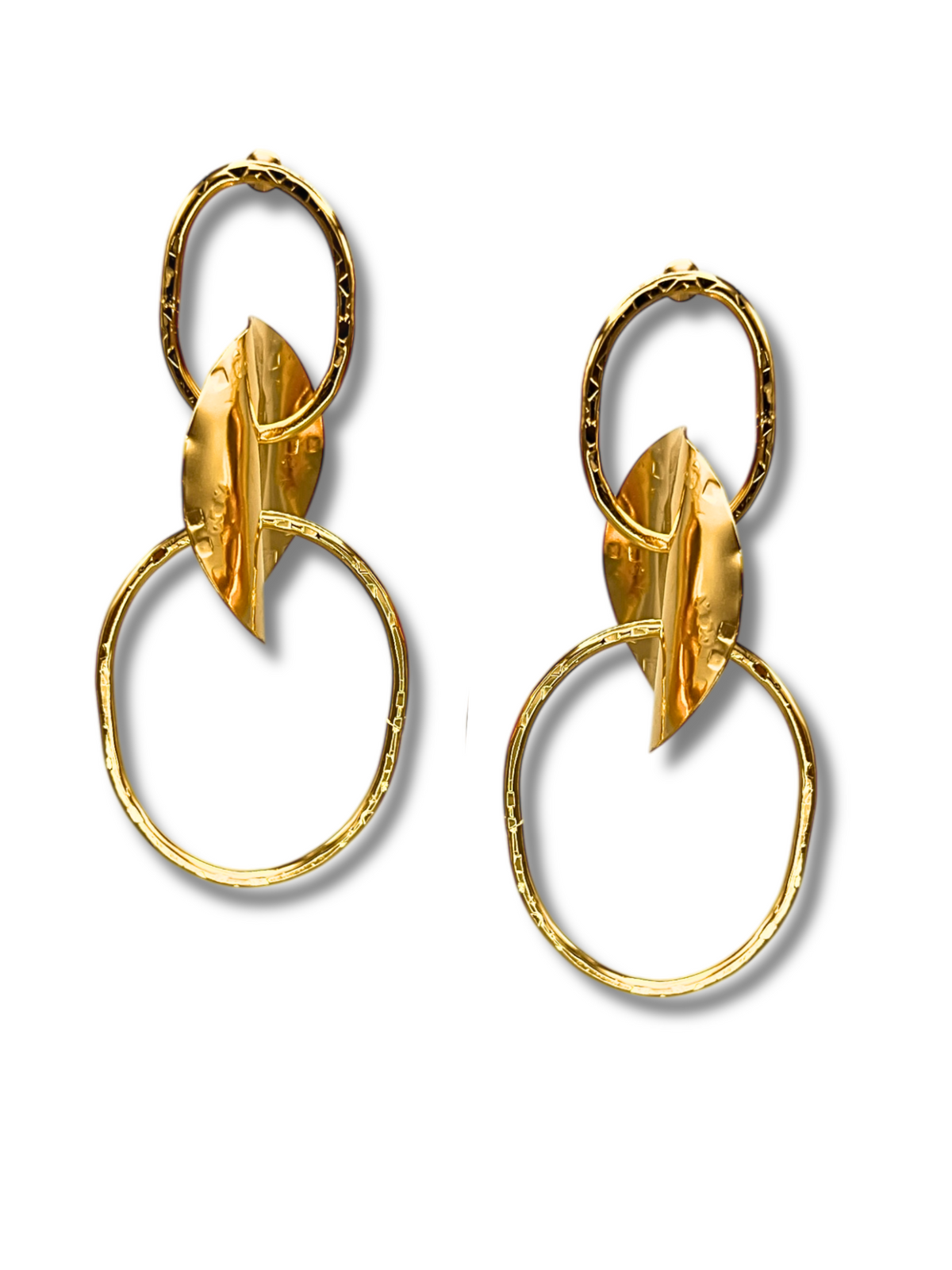 Gold Viviane Post Drop Earrings by JAREDJAMIN Jewelry Online showcase a textured small oval hoop linked to a larger circular one in hammered metal, featuring a leaf-like gold accent intersecting both for an artistic look.