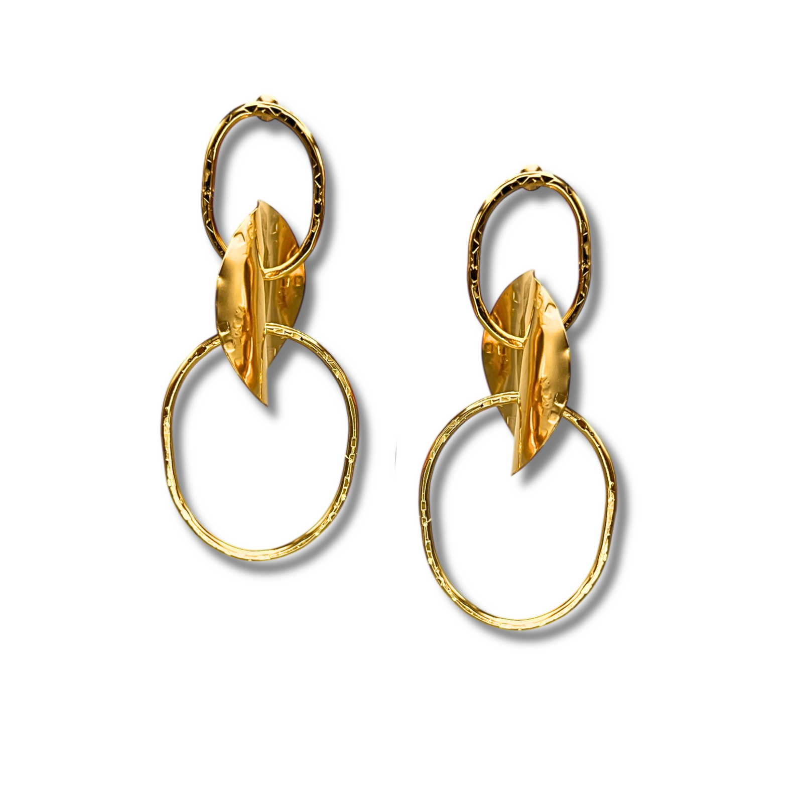 The Gold Viviane Post Drop Earrings from JAREDJAMIN Jewelry Online feature hammered metal ovals, curved leaf-like centers, and large irregular hoops—all in a shiny, textured gold finish.