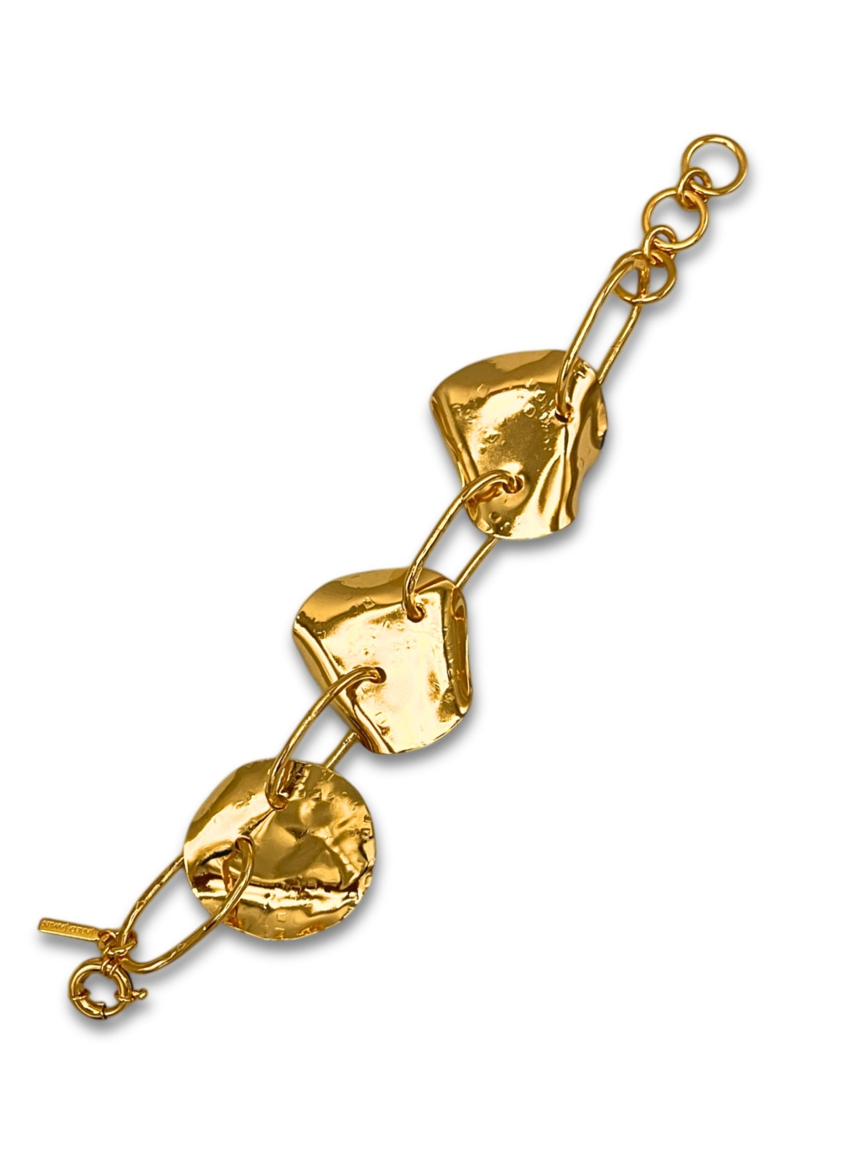 The Gold Viviane Link Bracelet by JAREDJAMIN Jewelry Online is a handcrafted statement piece with textured, organically-shaped discs linked by gold loops. Its shiny, uneven surfaces and circular connections create a natural, artisanal aesthetic on a white background.