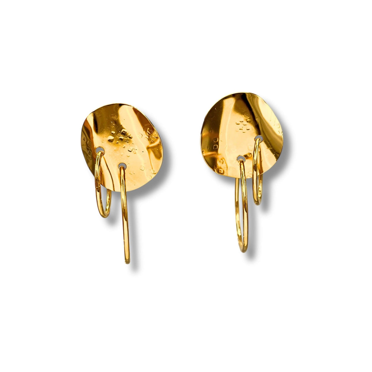 The Gold Viviane Clip-on Earrings by JAREDJAMIN Jewelry Online feature textured, hammered round studs with dangling gold hoops in a shiny finish, casting soft shadows on a white background.