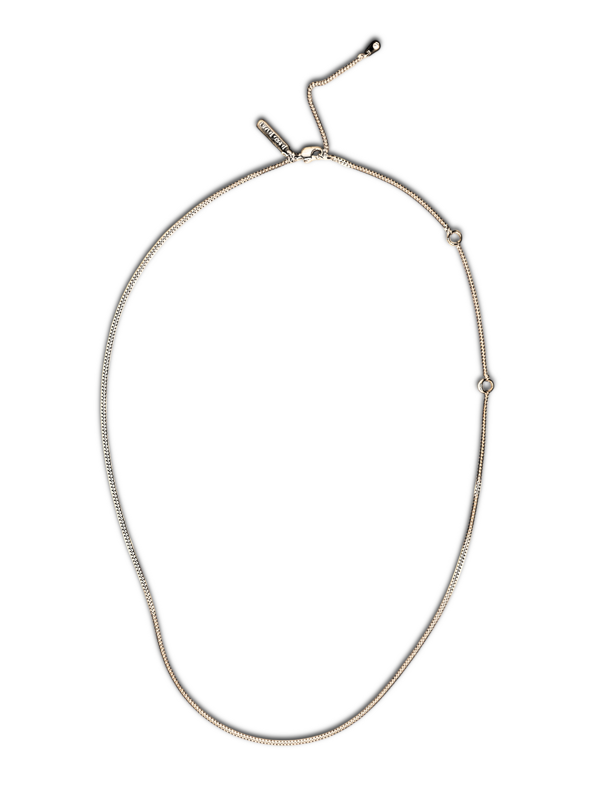 The Whisper Adjustable Chain Necklace from JAREDJAMIN Jewelry Online is an elegant, minimalist piece featuring a sleek silver snake chain with adjustable ends and bead-like stoppers. Its understated design makes it versatile for various occasions.