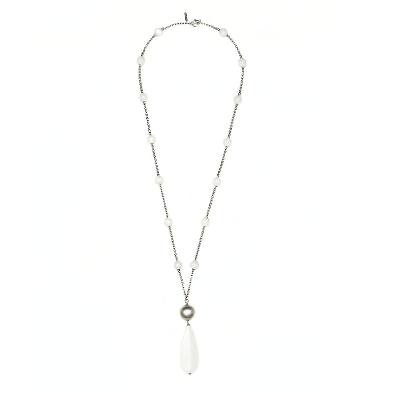 Detailed view of the Jared Jamin Bianca collar. Highlights the smooth 3.75-inch oversized white stone teardrop y the architectural plata-plated segmented links.