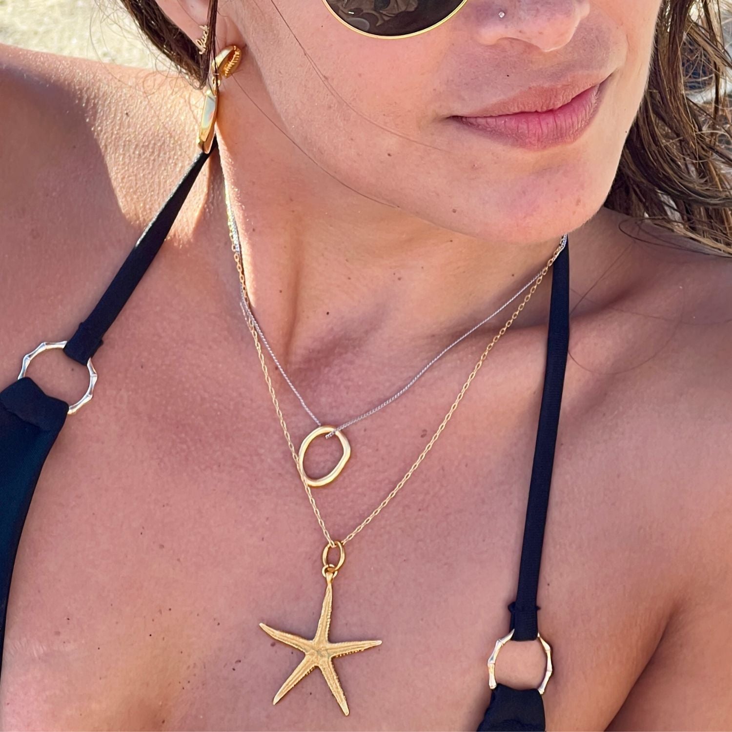 The Wish Upon A Starfish Chain Necklace by JAREDJAMIN Jewelry Online features a delicate gold chain with an adjustable fit and a textured 18K gold starfish pendant, displayed on a white background highlighting its detailed and shiny finish.