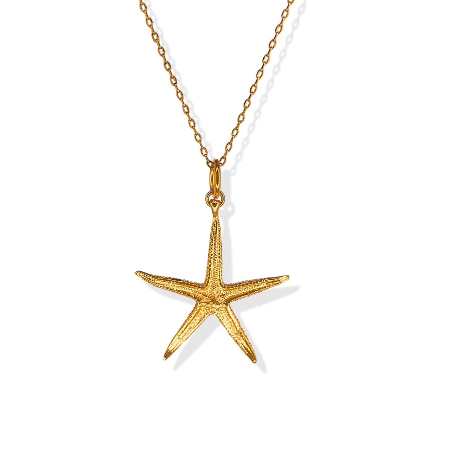 The Wish Upon A Starfish Chain Necklace by JAREDJAMIN Jewelry Online features a delicate gold chain with an adjustable fit and a textured 18K gold starfish pendant, displayed on a white background highlighting its detailed and shiny finish.