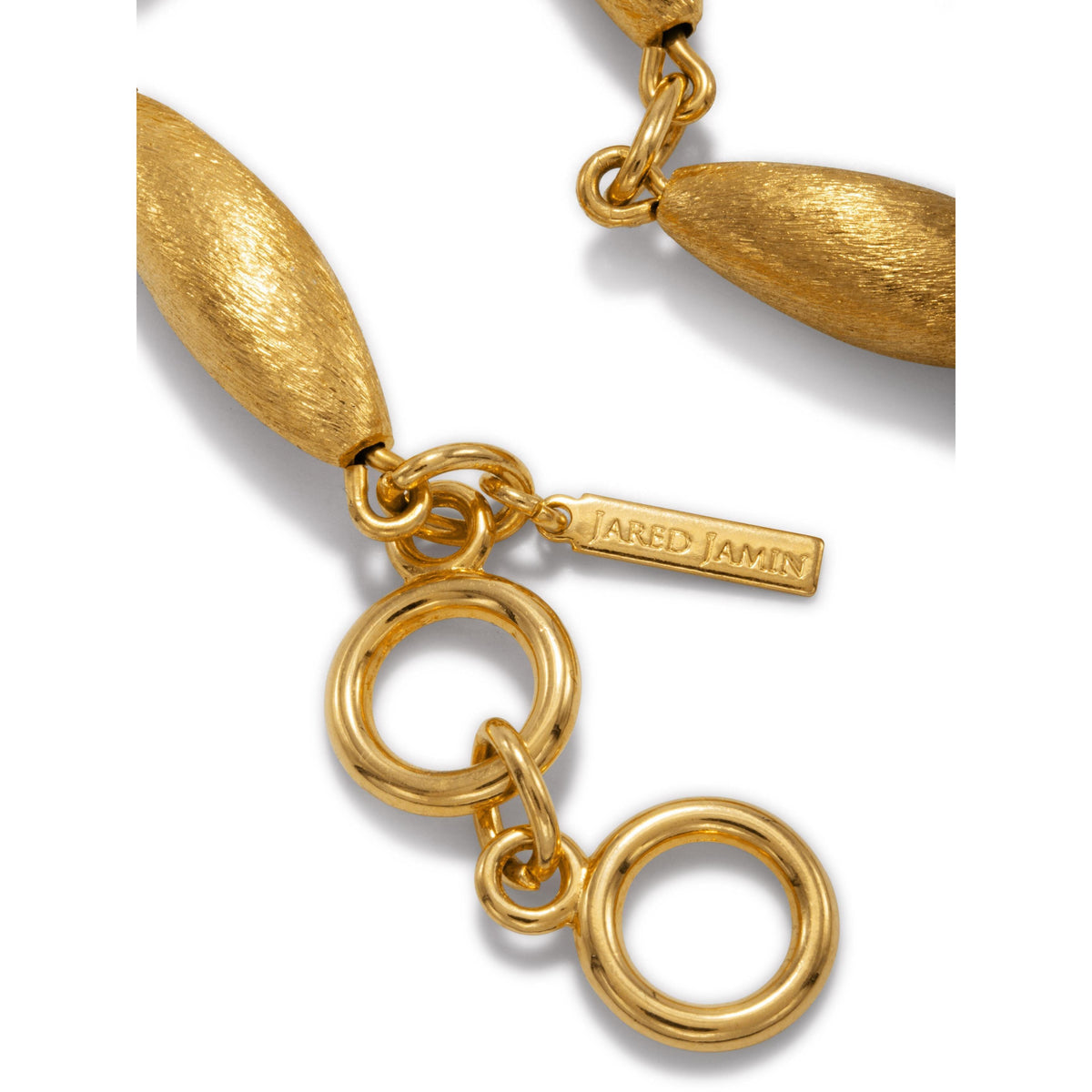 Zeppelin Phoebe Gold Necklace in 18K gold with signature brushed texture, oval beads, and a toggle clasp. Crafted in small-batch West Hollywood studios for sustainable luxury; includes signature tag. Shown on white background.