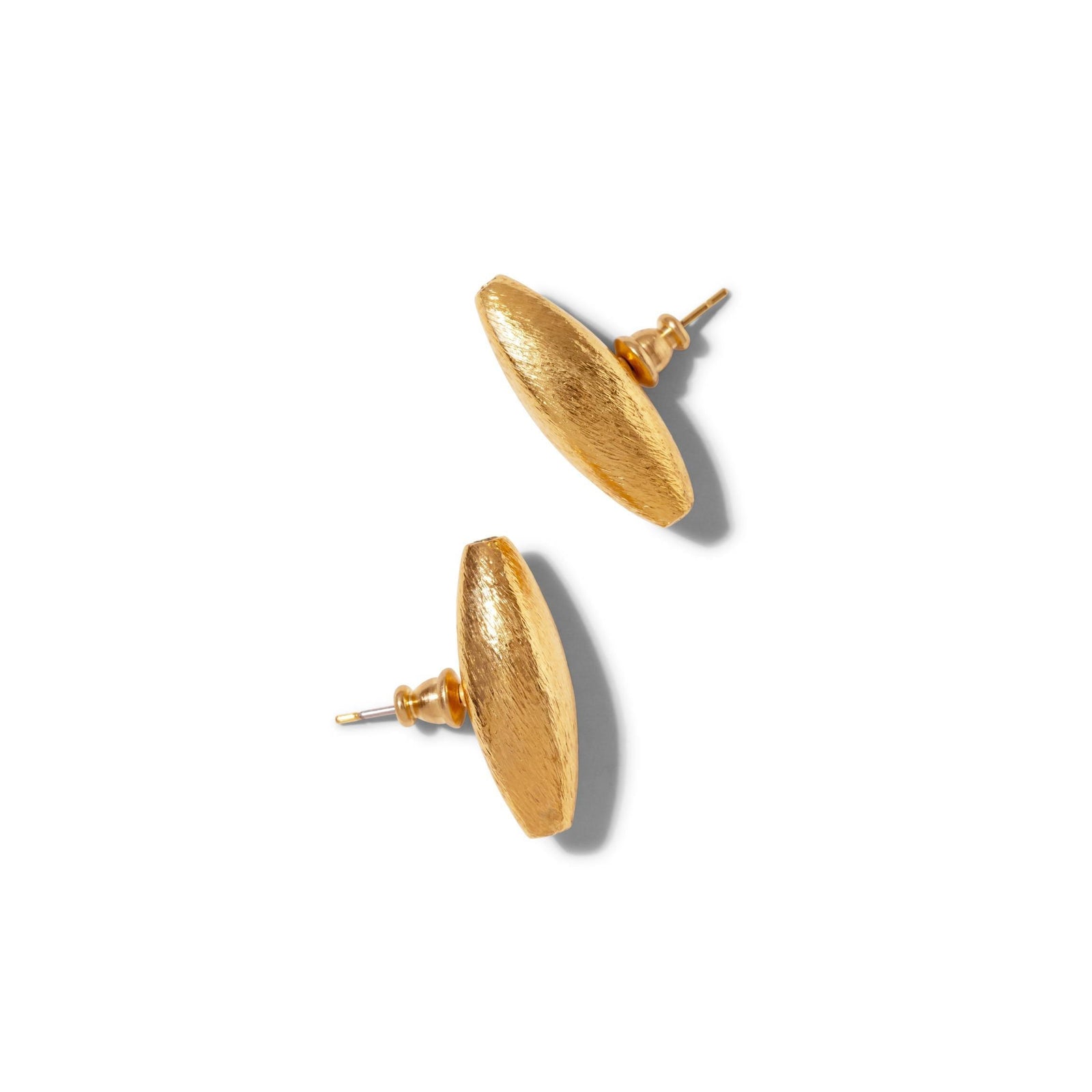 The Zeppelin Gold Stud Post Earrings from JAREDJAMIN Jewelry Online feature 18K goldplating, an oval domed shape, and a brush-textured matte finish. Shown diagonally on a white background with soft shadows.