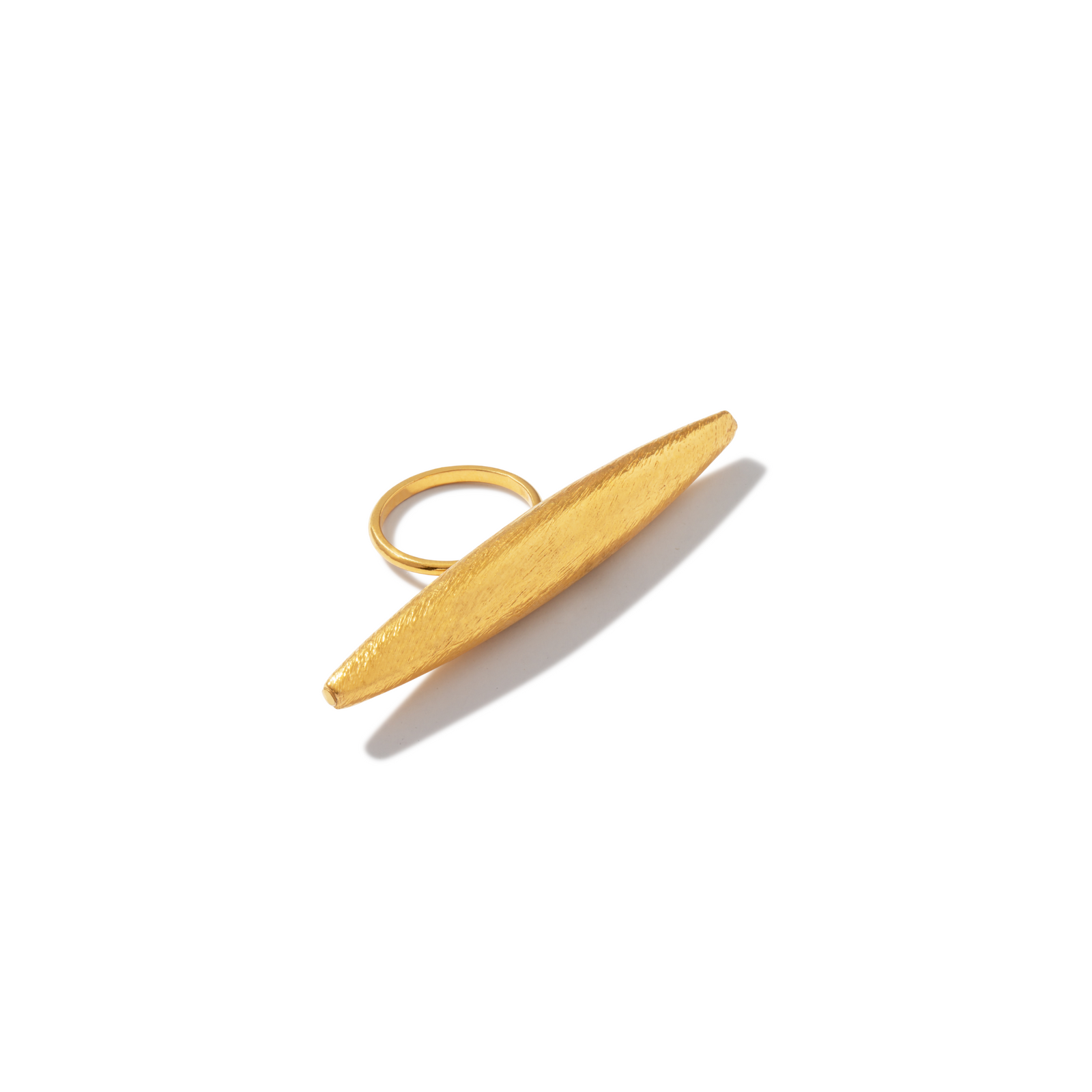 The Zeppelin Large Gold Ring by JAREDJAMIN Jewelry Online features a thin band and an elongated, oval-shaped top in 18k goldplated metal with a matte, textured finish for a sleek, modern look.