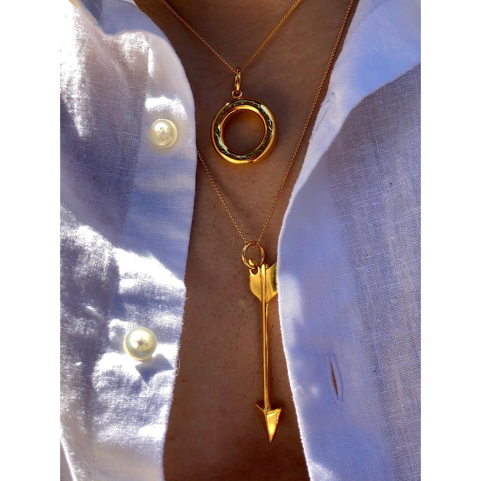 The Gold Arrow Necklace Pendant Charm by JAREDJAMIN Jewelry Online features an 18K gold-plated, textured surface and a small top loop for attaching to chains, shown against a white background.