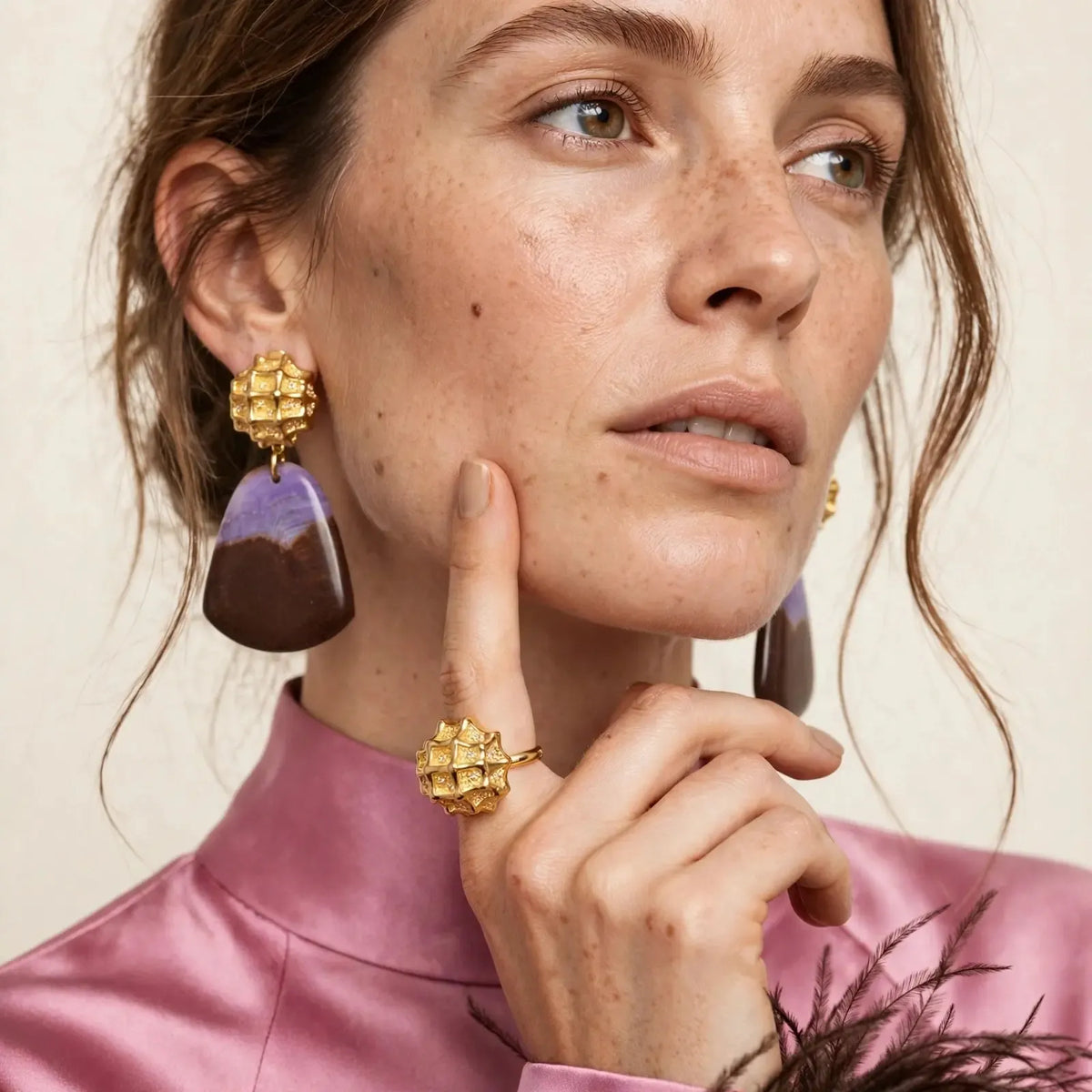 Model wearing Honeycomb clip-on earrings with purple and brown jasper drops and matching Honeycomb ring