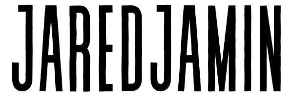 The image displays the name "JARED JAMIN" in bold, black, uppercase letters against a plain white background. The font is tall and narrow, with each letter closely spaced.